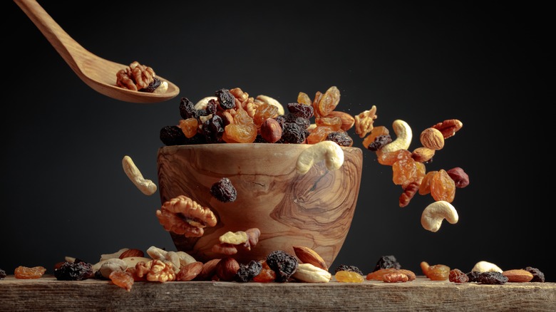 Nuts and dried fruit in a wooden bowl