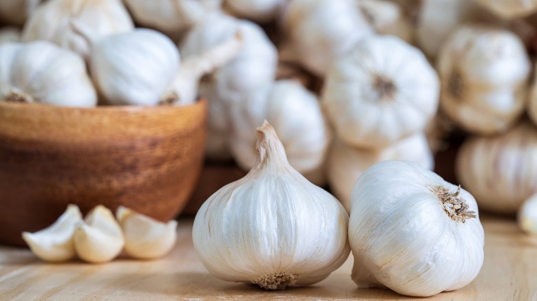 garlic bulbs on wooden table