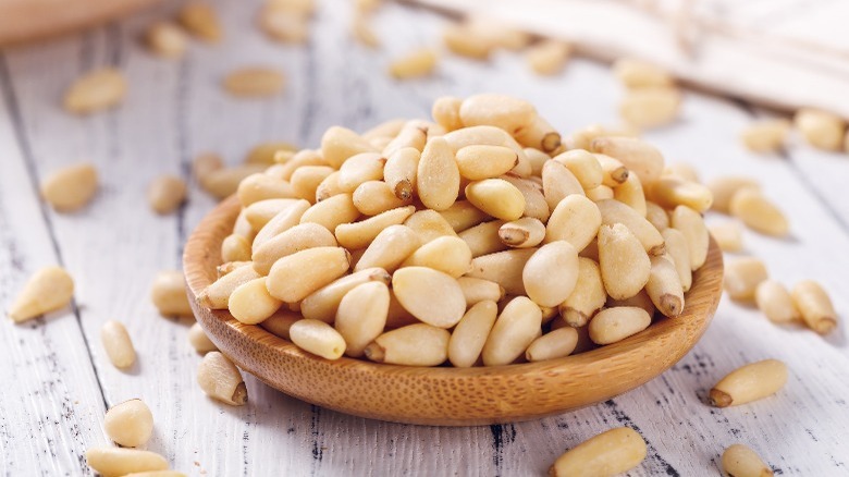 wooden bowl with pine nuts