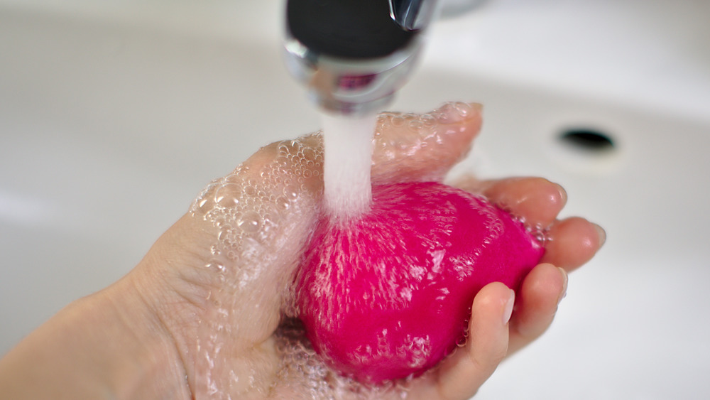 pink egg being washed