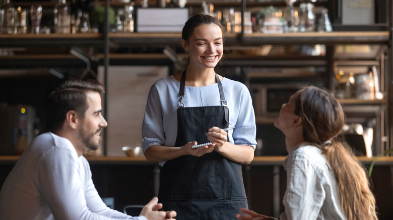 Restaurant server taking order