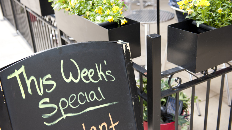 Specials chalkboard outside a restaurant 