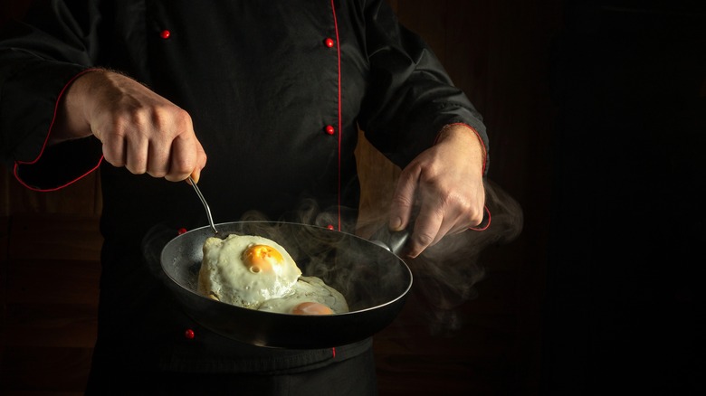 chef flipping egg