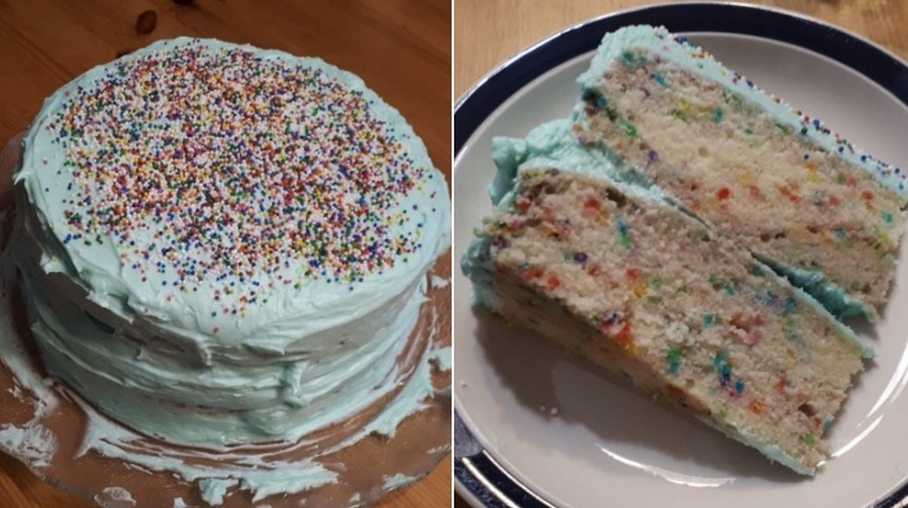 Sloppy cake with frosting bulging from the sides