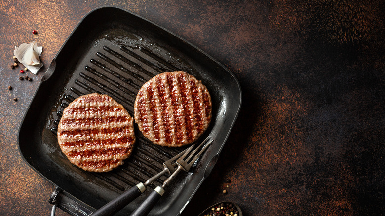 burgers on a cast iron grill