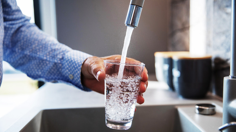 Filling a glass with water