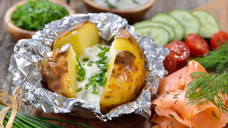 Stuffed baked potato wrapped in foil
