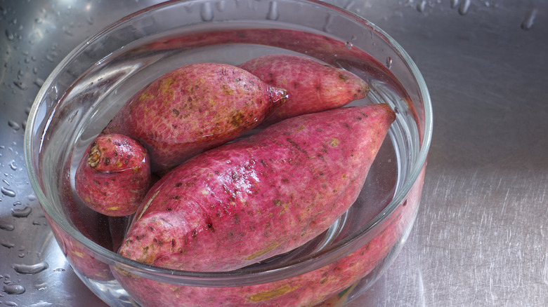 Potatoes soaking in cold water