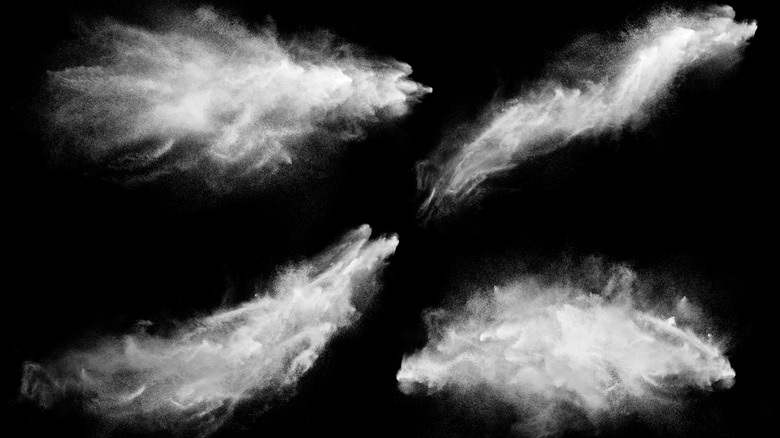 Powder splashed against a black background