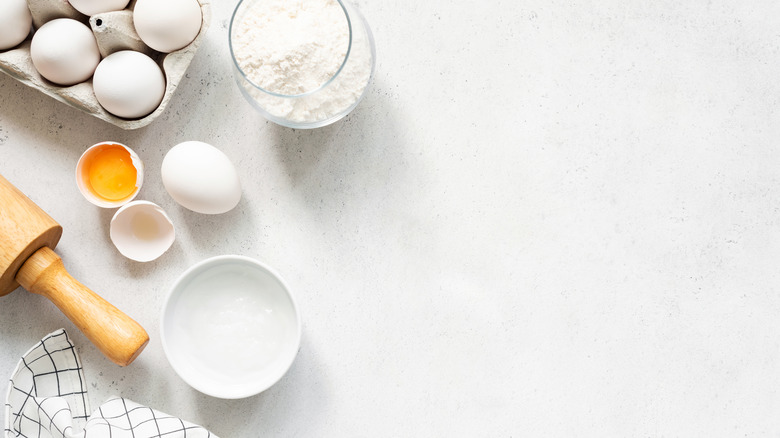 Cake ingredients on white counter