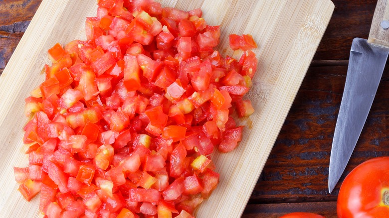 Diced tomatoes on a cutting board 