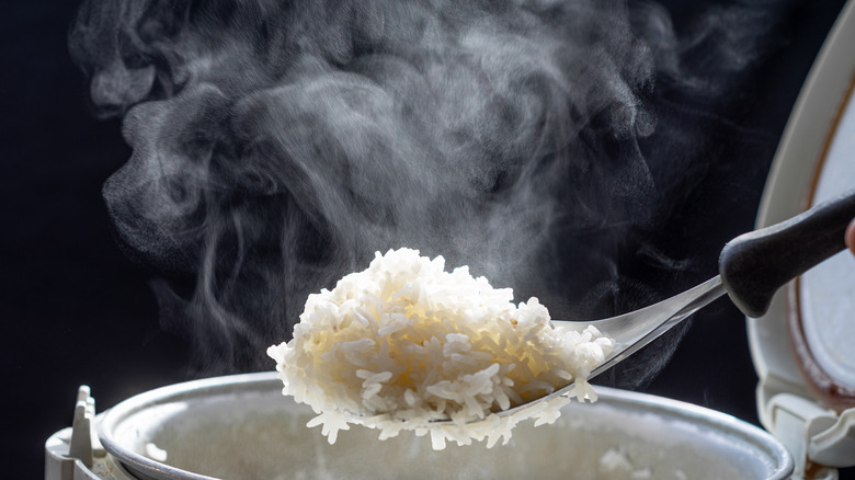 Steam rising from cooked rice