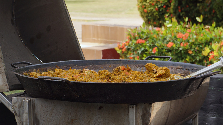 Paella resting on grill