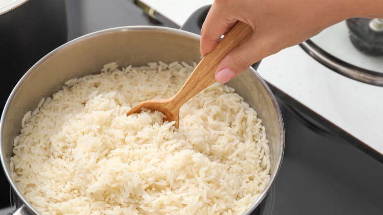 Stirring a pot of rice