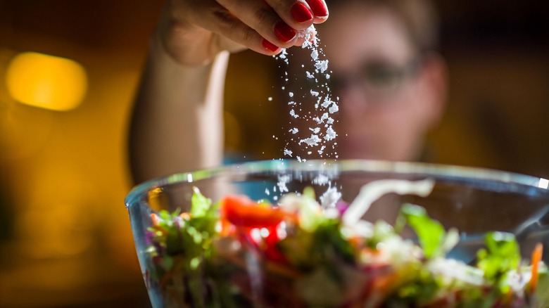 adding salt to salad