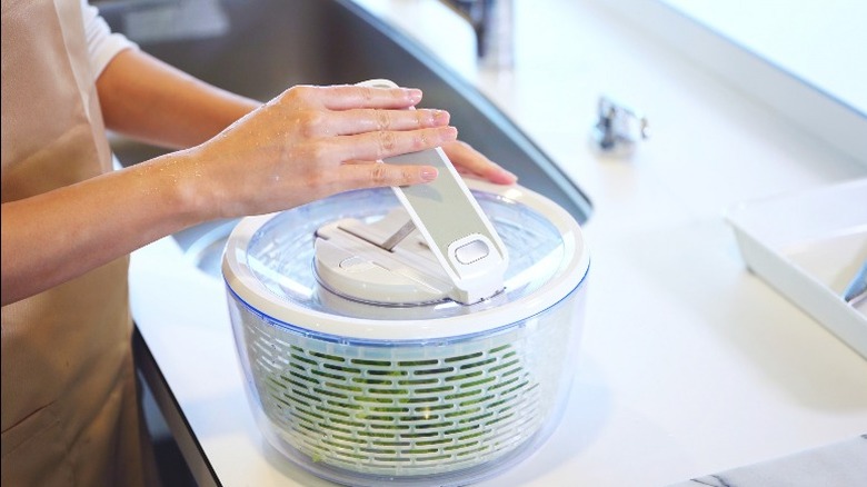 salad spinner under faucet