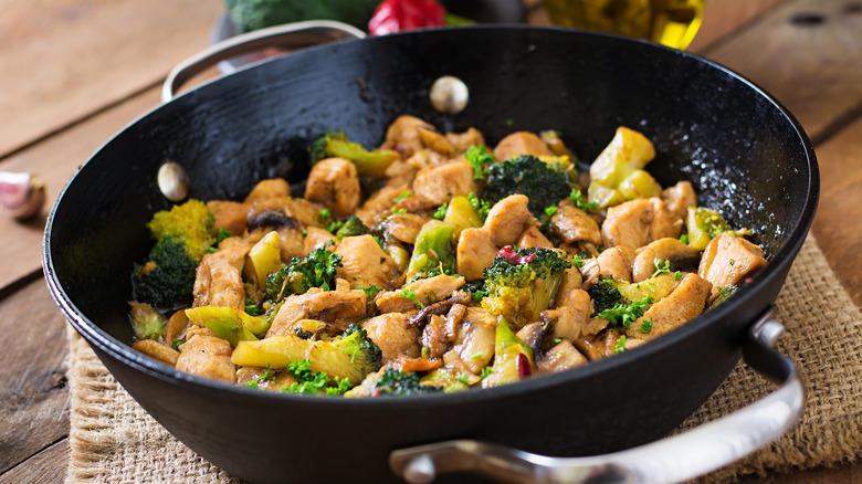 Wok with stir-fried chicken and broccoli