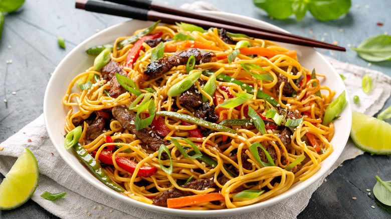 Stir-fried noodles in a white bowl