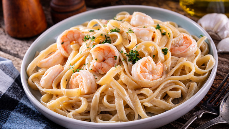 shrimp alfredo in white bowl