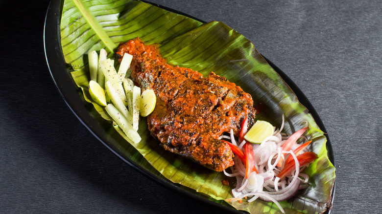 fried fish  on plantain leaf