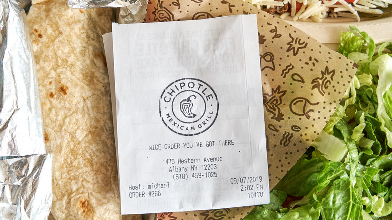 Chipotle plate and receipt with salad