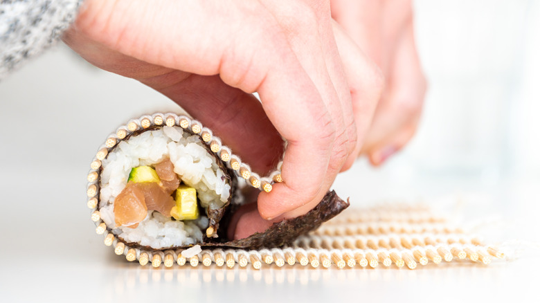 rolling sushi with bamboo mat