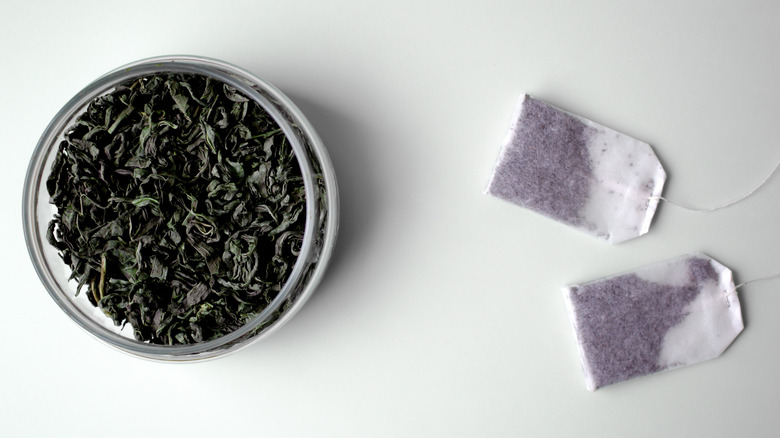 Bowl of tea leaves and tea bags