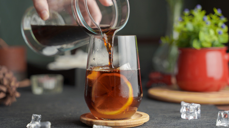 Iced tea being poured into glass