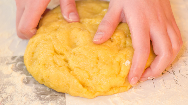 Person working with pastry dough