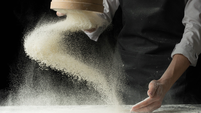 Dusting flour on counter