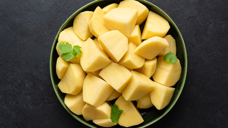 raw chopped potatoes in bowl