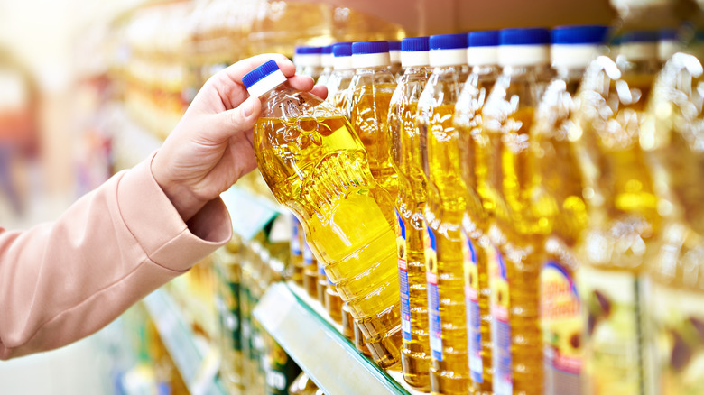 choosing oil at grocery store