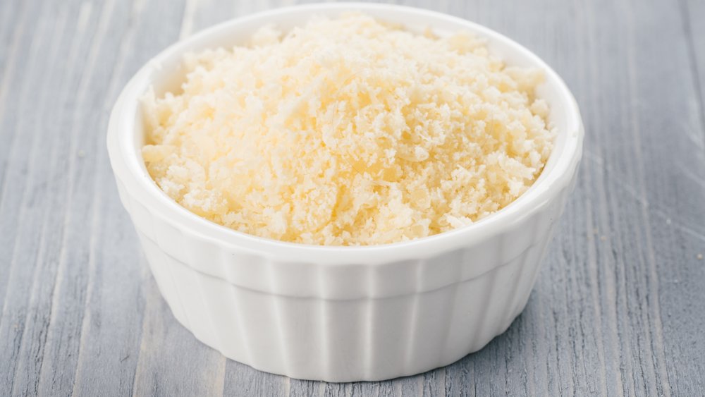 White ceramic bowl with grated parmesan cheese