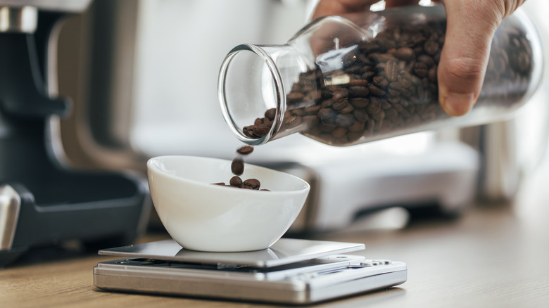 coffee beans being weighed on scale