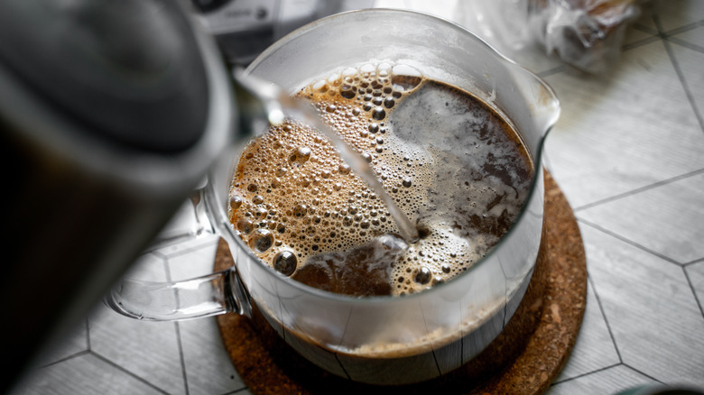 water pouring into French press carafe