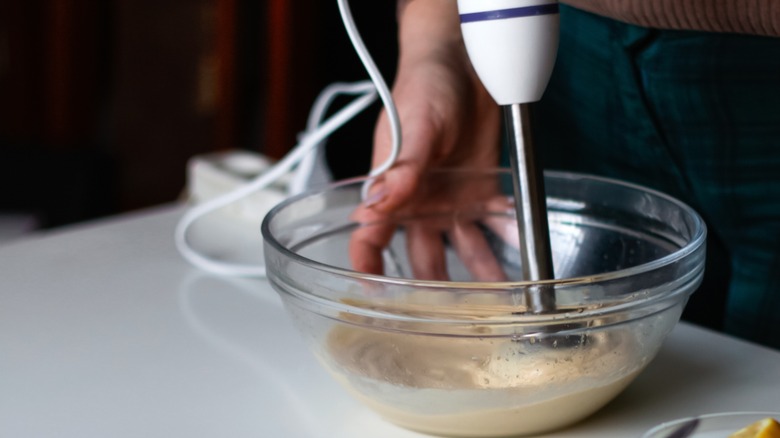 blending sauce with hand blender