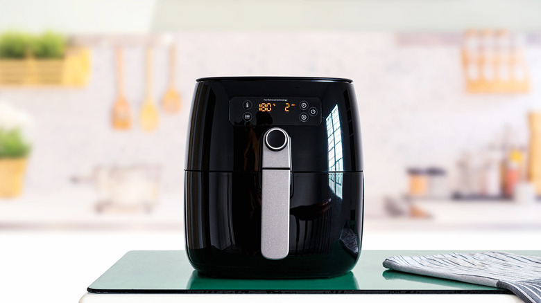 black air fryer on kitchen counter