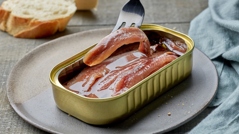 tin of anchovies on plate