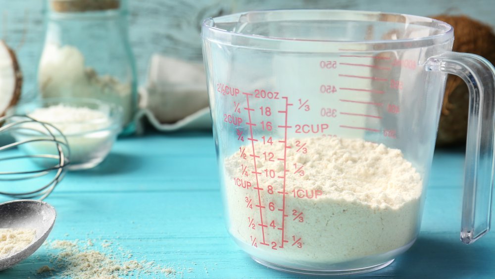 Measuring cup of flour for banana bread