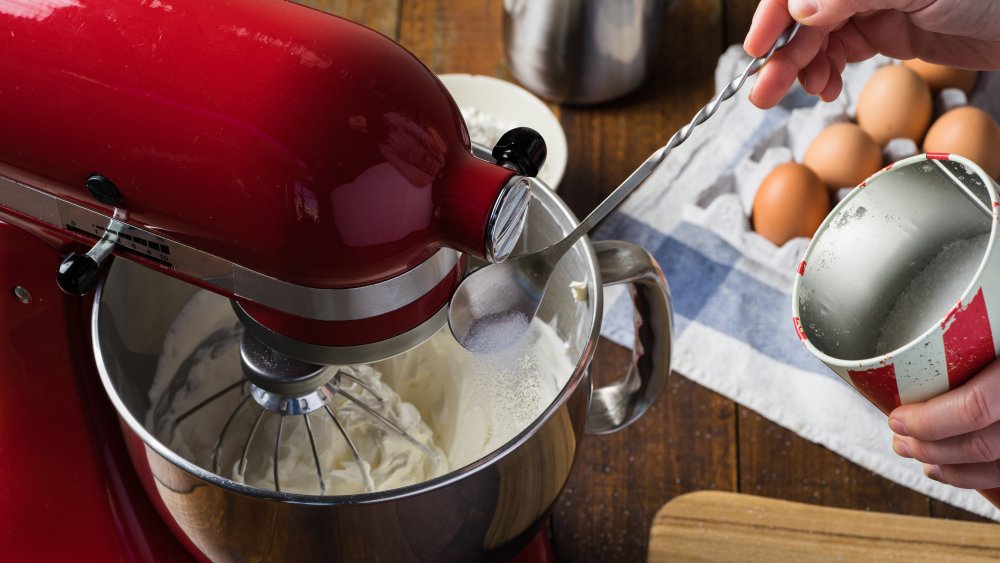 Adding sugar in a stand mixer for banana bread