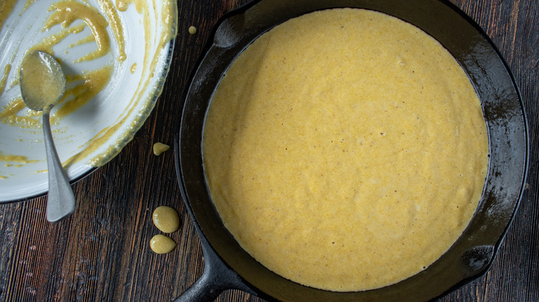 Cornmeal batter in pan