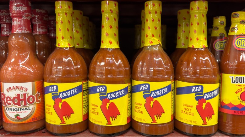 Bottles of hot sauce on shelf