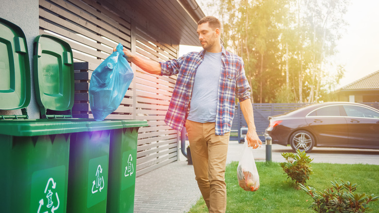 man tossing a bag