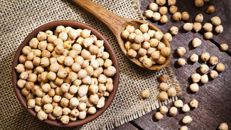 bowl and spoon full of dried chickpeas