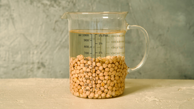 chickpeas soaking in a jug