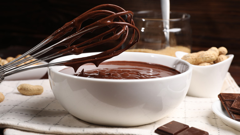 Bowl of chocolate ganache and whisk