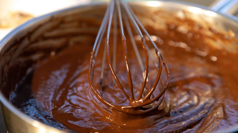 Chocolate cake batter and whisk