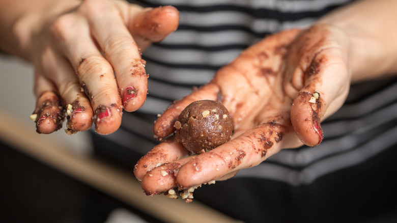 hands rolling truffles