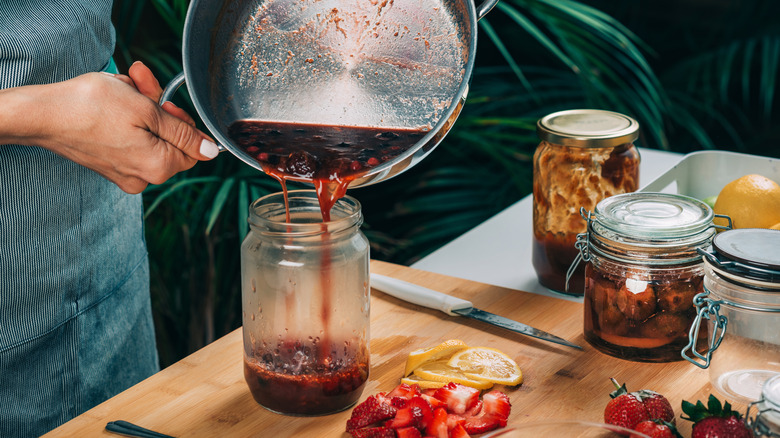 pouring substance into mason jar