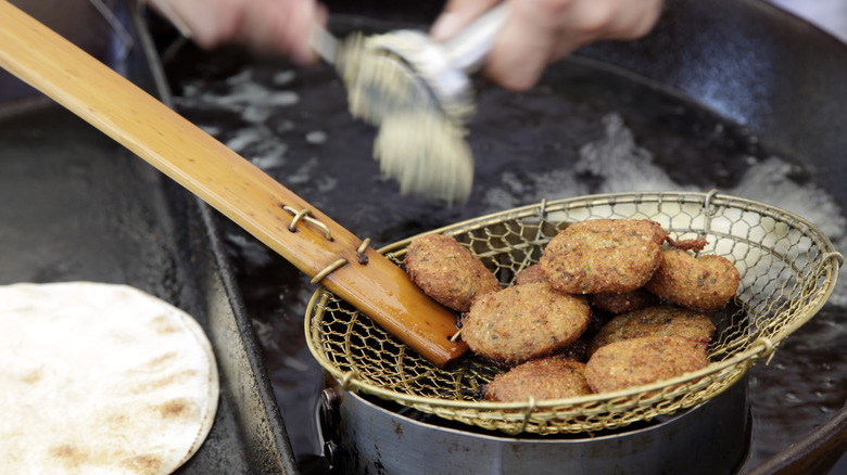 fried falafel in drainer